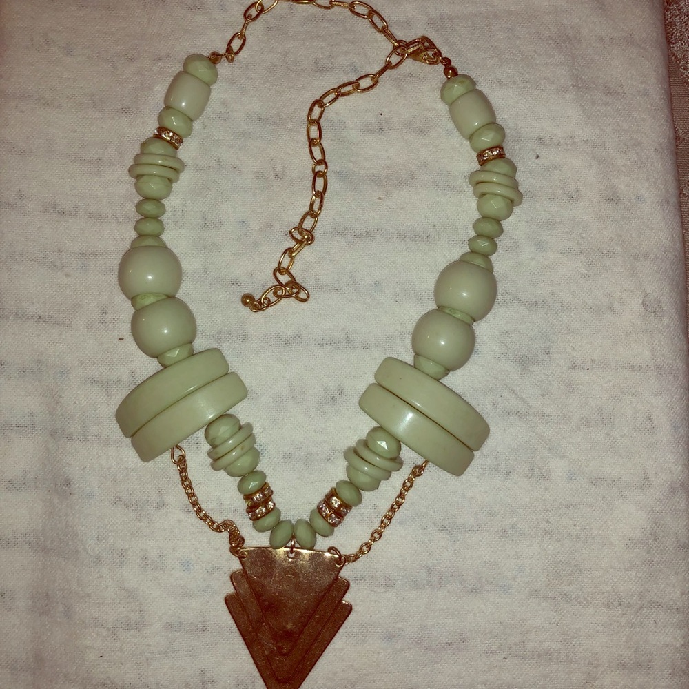Green and gold colored necklace